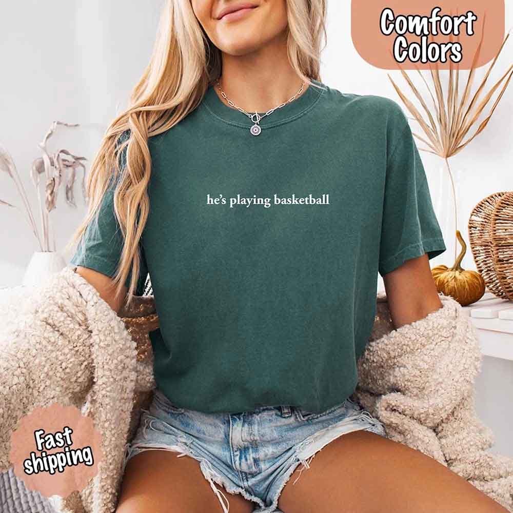 He’s Playing Basketball – Funny Sports Girlfriend Comfort Colors Shirt for Women