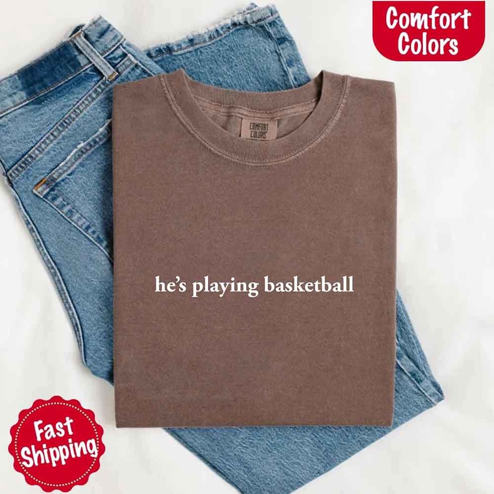 He’s Playing Basketball – Funny Sports Girlfriend Comfort Colors Shirt for Women