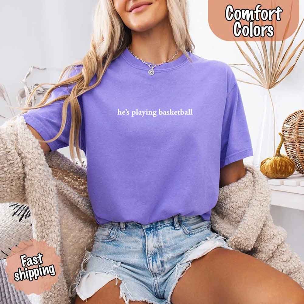 He’s Playing Basketball – Funny Sports Girlfriend Comfort Colors Shirt for Women