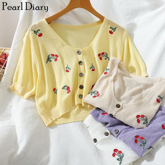 Cárdigan corto tejido con estampado floral