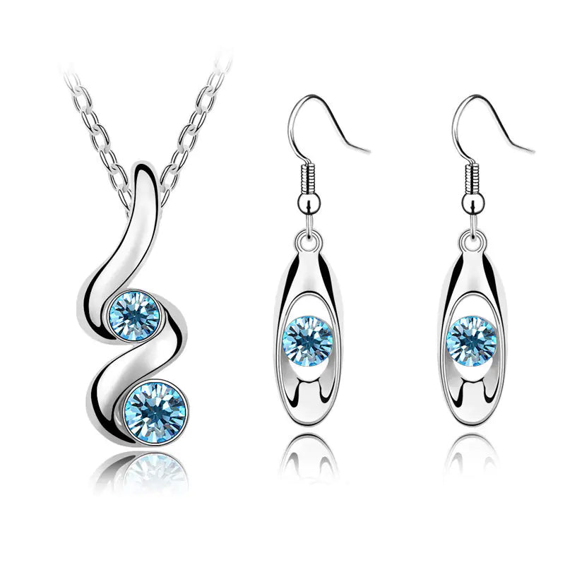 Juego de pendientes ovalados y collar con forma de serpiente y cristales